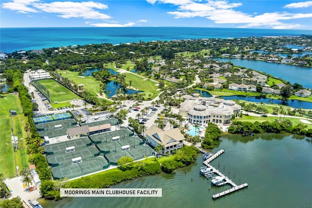 birds eye view of property with a water view