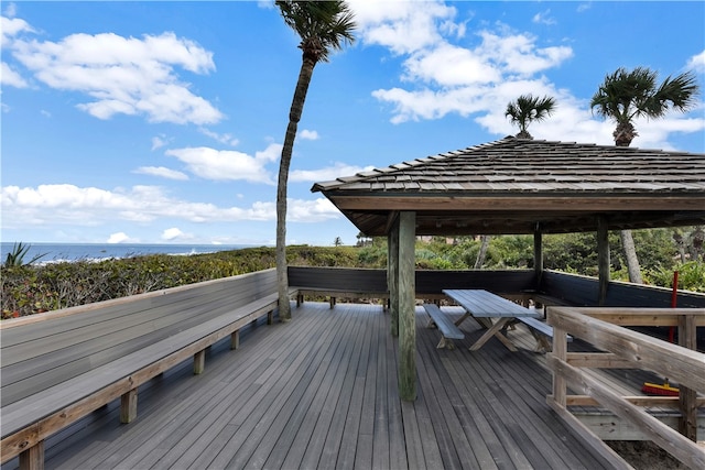 wooden deck with a water view