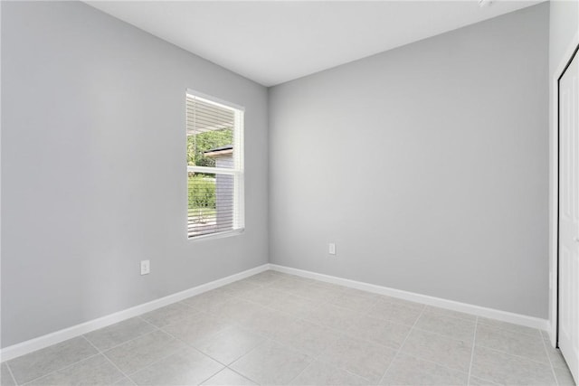 426 Douglas Ct, Fort Pierce, FL 34950 - empty room with light tile patterned floors and baseboards