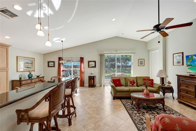 living room featuring ceiling fan, light tile patterned floors, and lofted ceiling