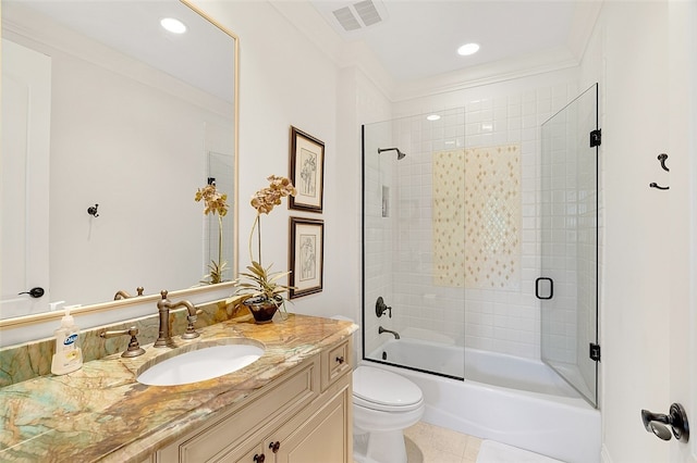 full bathroom featuring crown molding, tile patterned flooring, bath / shower combo with glass door, and toilet