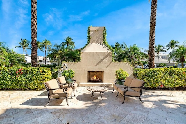 1507 Ocean Dr Unit 5, Vero Beach, FL 32963 - view of patio with an outdoor stone fireplace
