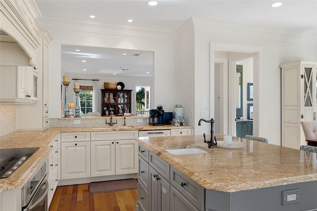 1507 Ocean Dr Unit 5, Vero Beach, FL 32963 - kitchen with a sink, black electric cooktop, oven, gray cabinetry, and recessed lighting