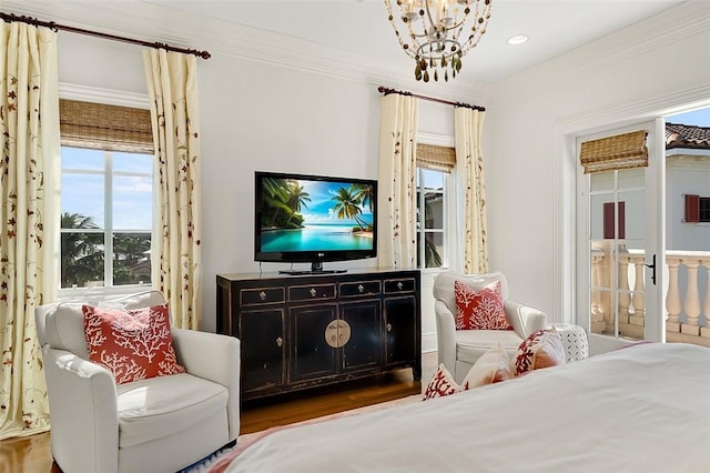 1507 Ocean Dr Unit 5, Vero Beach, FL 32963 - bedroom with multiple windows, a chandelier, wood finished floors, recessed lighting, and crown molding