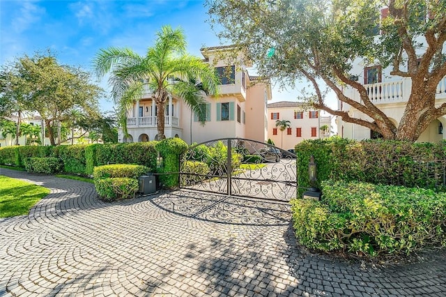 1507 Ocean Dr Unit 5, Vero Beach, FL 32963 - view of front of home featuring a gate, stucco siding, and a balcony