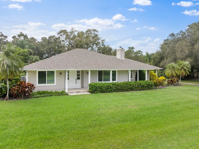 ranch-style home with a front lawn and a porch