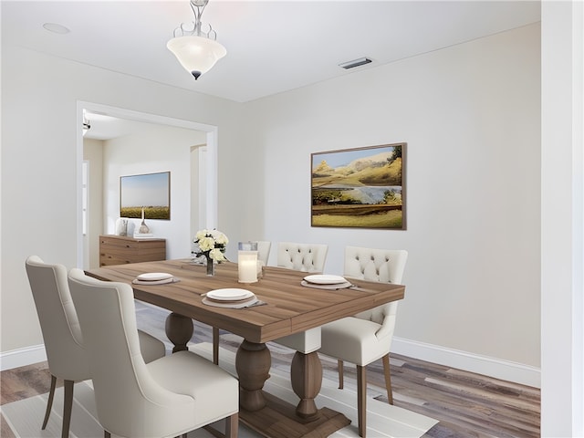 dining area with hardwood / wood-style floors