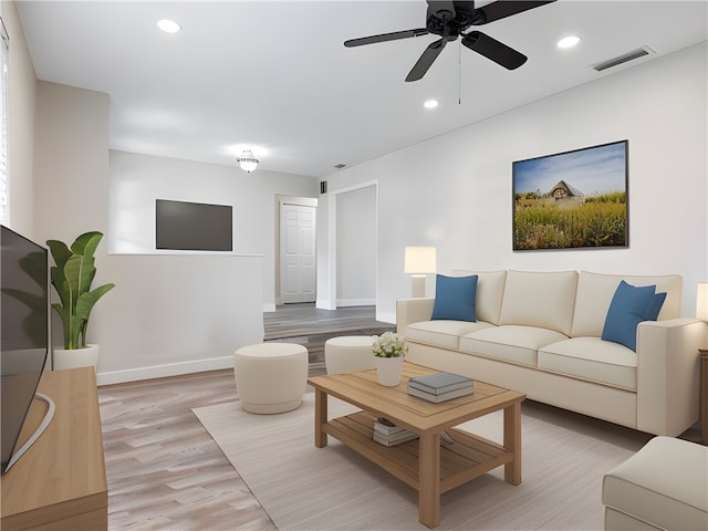 living room featuring light hardwood / wood-style floors and ceiling fan