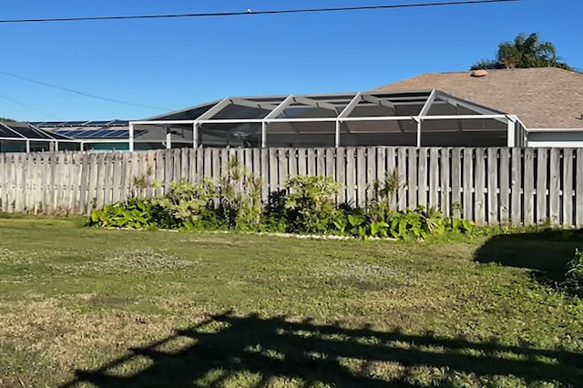 view of yard with a lanai