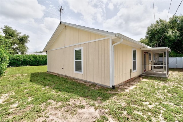 2225 86th Dr, Vero Beach, FL 32966 - view of property exterior with a sunroom