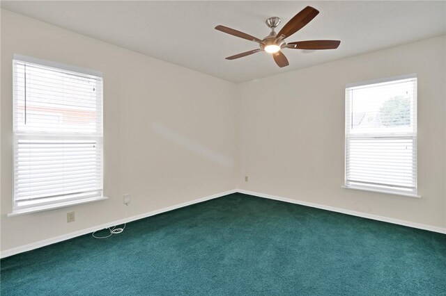 2225 86th Dr, Vero Beach, FL 32966 - unfurnished room with carpet floors, ceiling fan, and baseboards