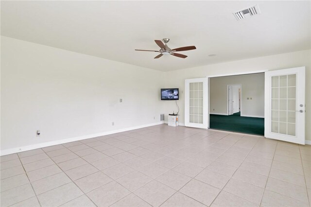 2225 86th Dr, Vero Beach, FL 32966 - spare room with french doors, a ceiling fan, baseboards, and light tile patterned floors