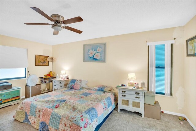 125 Capri Ave, Sebastian, FL 32958 - kitchen with stainless steel appliances, light tile patterned flooring, a breakfast bar area, and light countertops
