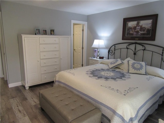 bedroom featuring dark hardwood / wood-style floors