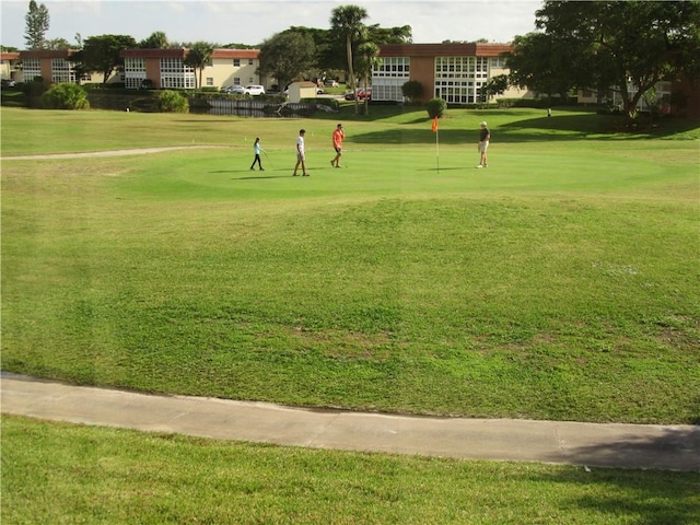 surrounding community featuring a yard