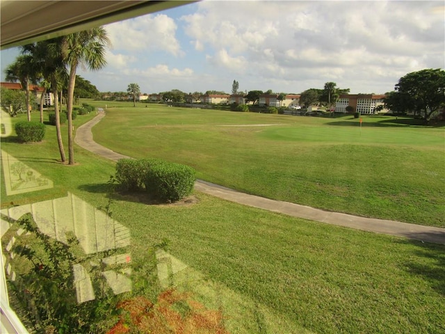 view of home's community featuring a lawn