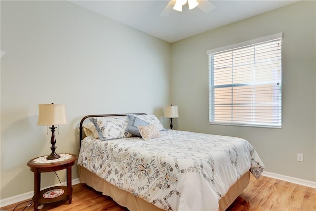 6375 Oxford Cir Unit 104D, Vero Beach, FL 32966 - bedroom featuring wood finished floors, ceiling fan, and baseboards