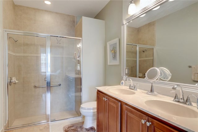 6375 Oxford Cir Unit 104D, Vero Beach, FL 32966 - bathroom with toilet, double vanity, a sink, and a shower stall