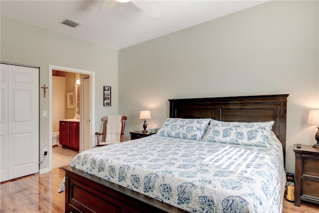 6375 Oxford Cir Unit 104D, Vero Beach, FL 32966 - bedroom with visible vents, ceiling fan, ensuite bathroom, and light wood-style floors