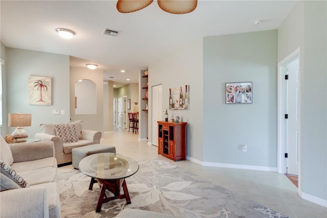6375 Oxford Cir Unit 104D, Vero Beach, FL 32966 - living area featuring arched walkways, ceiling fan, baseboards, visible vents, and light tile patterned flooring