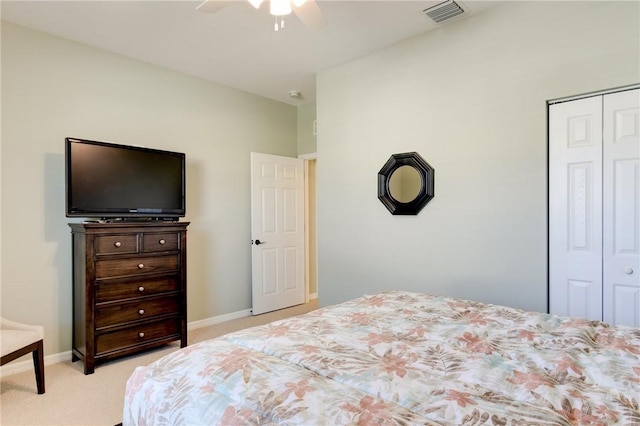 6375 Oxford Cir Unit 104D, Vero Beach, FL 32966 - bedroom with a closet, ceiling fan, visible vents, light carpet, and baseboards
