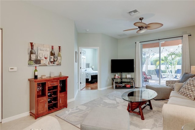 6375 Oxford Cir Unit 104D, Vero Beach, FL 32966 - living area with baseboards, visible vents, light tile patterned floors, and ceiling fan