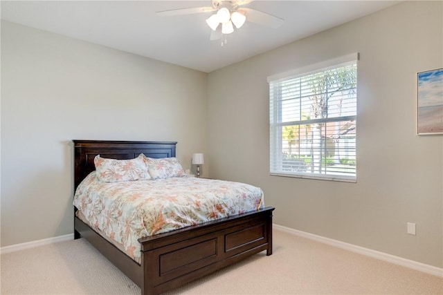 6375 Oxford Cir Unit 104D, Vero Beach, FL 32966 - bedroom featuring ceiling fan, light carpet, and baseboards