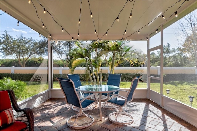 6375 Oxford Cir Unit 104D, Vero Beach, FL 32966 - sunroom / solarium featuring track lighting and outdoor dining space
