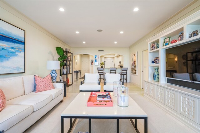 living room with ornamental molding