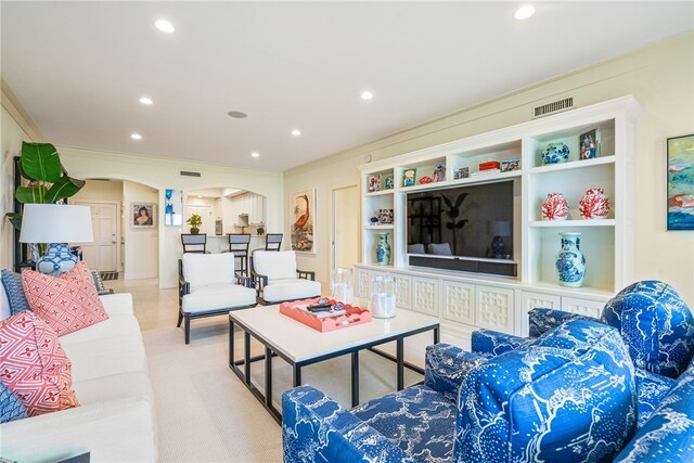 living room with ornamental molding