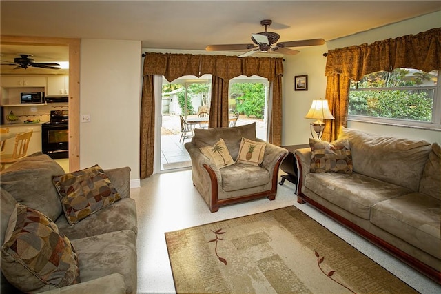 living area featuring a ceiling fan