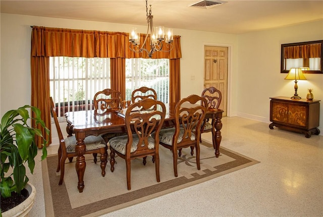 dining space featuring visible vents, baseboards, light speckled floor, and an inviting chandelier