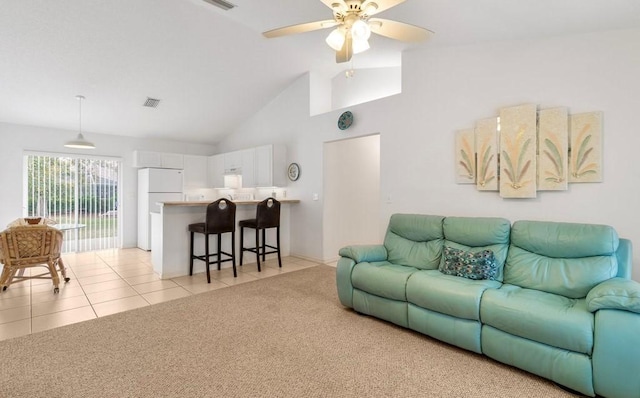 living room featuring light tile patterned flooring, ceiling fan, and high vaulted ceiling