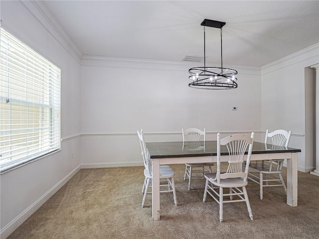 135 Stony Point Dr, Sebastian, FL 32958 - carpeted dining room with crown molding, a chandelier, and baseboards