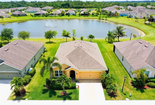 aerial perspective of suburban area featuring a large body of water