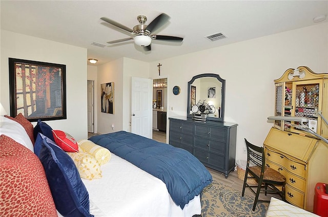 bedroom featuring light wood finished floors and a ceiling fan