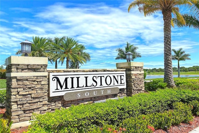 community sign with a water view
