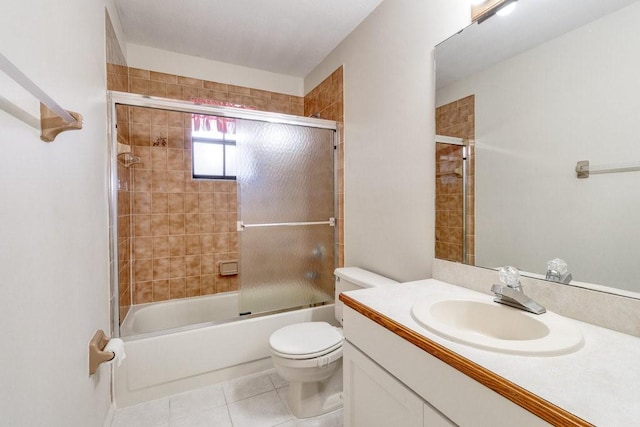 full bathroom featuring tile patterned floors, vanity, enclosed tub / shower combo, and toilet