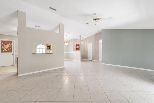 unfurnished room featuring light tile patterned floors, ceiling fan, and lofted ceiling