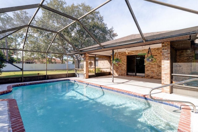 view of swimming pool featuring a patio area and a lanai