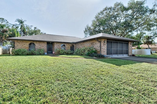 ranch-style home with a front yard