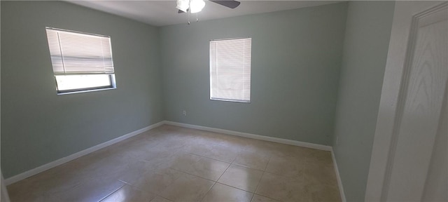 412 7th Rd SW, Vero Beach, FL 32962 - spare room featuring a ceiling fan, light tile patterned flooring, and baseboards