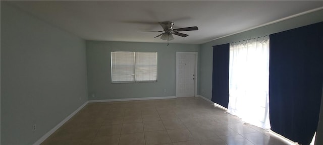 412 7th Rd SW, Vero Beach, FL 32962 - tiled empty room with ceiling fan and baseboards