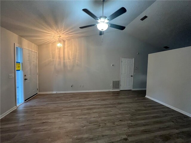 spare room featuring ceiling fan and dark wood-type flooring