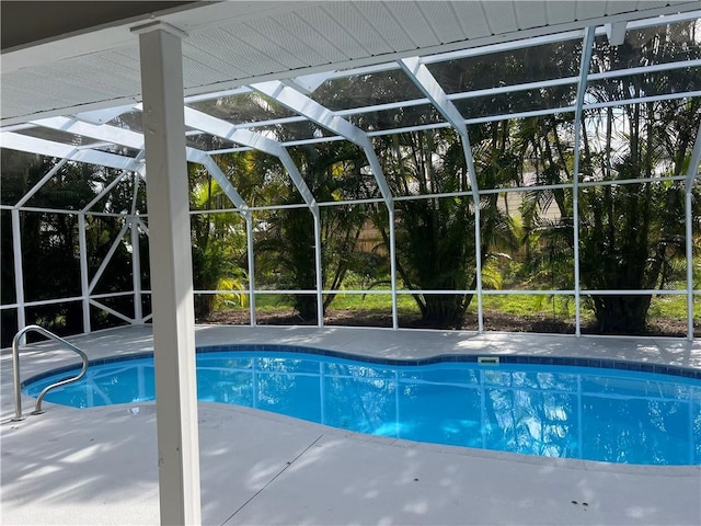 view of pool featuring a lanai and a patio