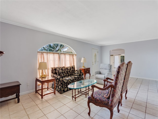 living room with light tile patterned floors and crown molding