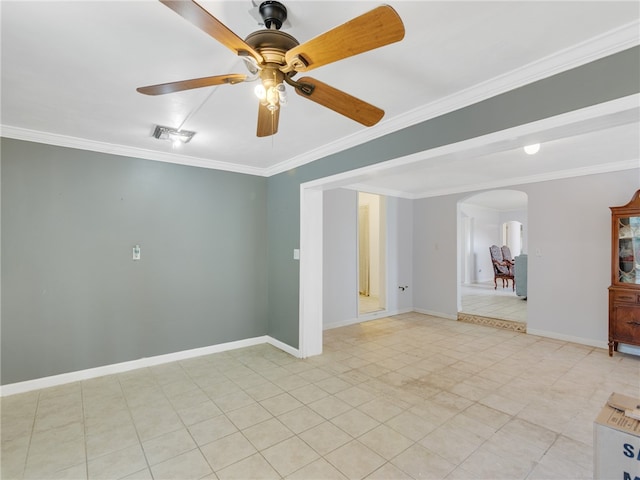 spare room featuring ornamental molding and ceiling fan