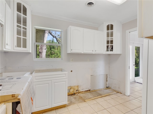 washroom featuring ornamental molding and light tile patterned floors