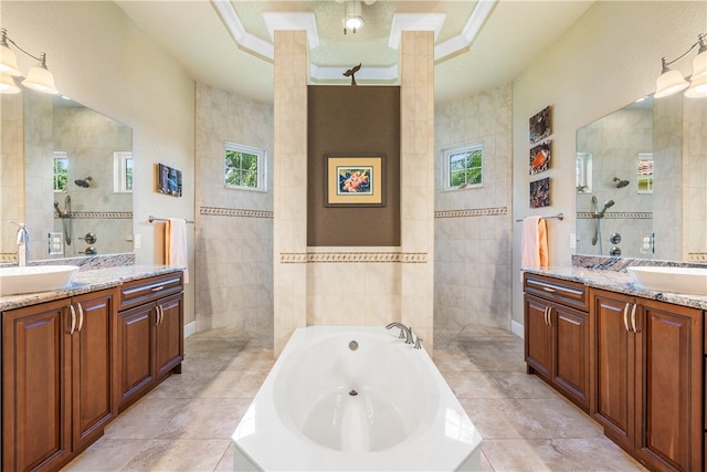 bathroom with independent shower and bath, ornamental molding, tile walls, and vanity