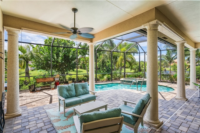 view of patio / terrace featuring glass enclosure, outdoor lounge area, a pool with hot tub, and ceiling fan